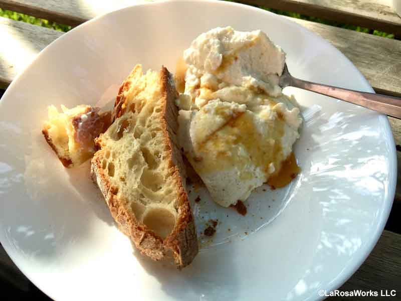 Local honey drizzled over crusty bread and fresh ricotta.