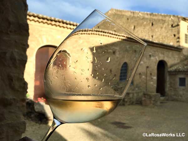Hotel in Sicily through a wine glass lightly.